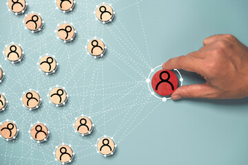 hand holding to select human icon with connection linkage for human resource management and recruitm