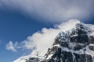 Wall Mural - Low angle shot of the mountains covered with snow and fog, Antarctica