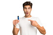 © Asier - Young caucasian man holding an electronic cigarette isolated pointing to the side