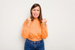© Asier - Young caucasian cute woman isolated on white background showing fist to camera, aggressive facial expression.