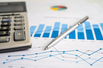 Calculator on chart and graph spreadsheet paper. Finance development, Banking Account, Statistics, Investment Analytic research data economy, Stock exchange trading, Business company concept.