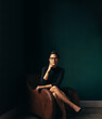 © Jacob Lund - Independent business woman sitting in chair