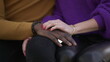 © Marco - Girlfriend hand caressing boyfriend. Interracial diverse couple, close-up hands