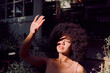 © C Haas/peopleimages.com - Sun, shadow and hand with a black woman covering her face from the light while standing outdoor. Beauty, afro and sunlight with an attractive young female blocking her head and skin from sunshine
