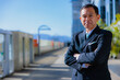 © DRN Studio - Middle-aged Asian man in black business suit at Kyoto station, Japan.