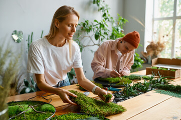 Professional florists working at creative art studio