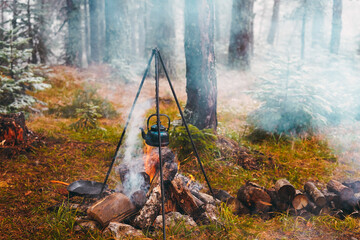 Wall Mural - Old kettle in bushcraft camping