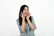 © Parichat - Excited young asian woman with raised hand celebrating success Portrait cheerful positive asian female with raised hands and fists open mouth Girl get happy enjoy life white background copy space.
