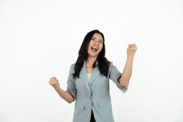 Excited young asian woman with raised hand celebrating success Portrait cheerful positive asian female with raised hands and fists open mouth Girl get happy enjoy life white background copy space.