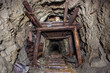 Old gold mine underground tunnel with wooden timbering