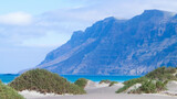 Fototapeta Do pokoju - Beach and mountains - beautiful coast in Caleta de Famara, Lanzarote Canary Islands.