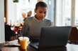 © Flamingo Images - Young female entrepreneur working on her break in a cafe