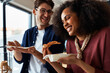 © Flamingo Images - Friends laughing and eating pizza