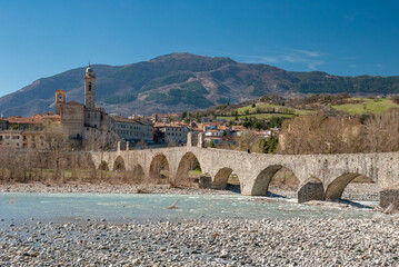 The old medieval bridge called Ponte Gobbo over the river Trebbia in the small town of Bobbio, in northern Italy