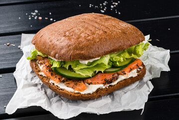 Wall Mural - Sandwich with fish salmon, lettuce, cucumber and mayonnaise.