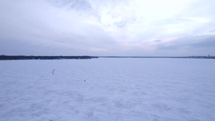 Wall Mural - Kite skiing on a frozen Lake Monona in Madison, WI. 