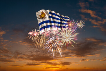 Wall Mural - Flag of Uruguay and Holiday fireworks in sky