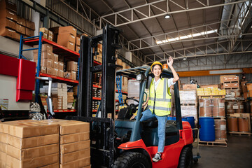 Wall Mural - Warehouse worker with a forklift in the warehouse or storehouse., Industrial and industrial concept.