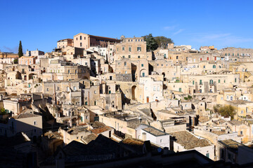 Wall Mural - View of Sassi di Matera a historic district in the city of Matera, well-known for their ancient cave dwellings from the Belvedere di Murgia Timone, Basilicata, Italy