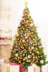 Wall Mural - A large beautiful traditional Christmas tree with gifts in a classic interior.