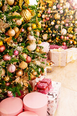 Wall Mural - boxes with gifts on the Christmas tree with classic decorations.