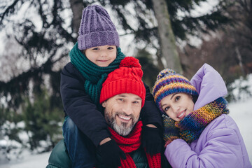 Sticker - Portrait of three peaceful positive people embrace toothy smile walking snowy forest outside