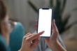 © perfectlab - Woman hand holding using touch mobile phone white screen mockup Back view