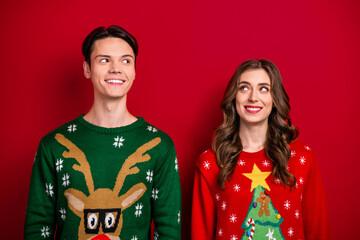 Poster - Photo of cute cheerful brother sister wear xmas sweaters looking empty space isolated red color background