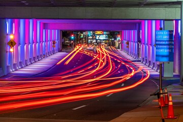 Poster - Long exposure shot of the light trails along the road in the tunnel