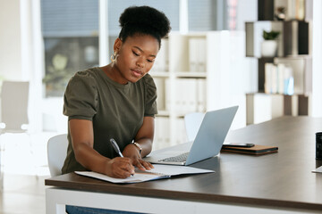 Corporate black woman, notebook and writing in planning, schedule or strategy for job as receptionist. Woman, professional and laptop on table by book, working or thinking of idea for research notes