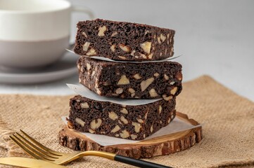 Wall Mural - Chocolate brownies with peanut on a wooden board