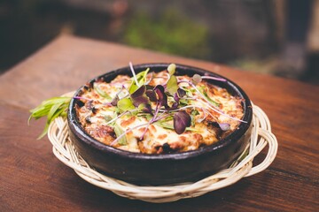 Sticker - Delicious meat with cheese on top in bowl