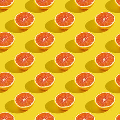 Wall Mural - Seamless pattern with half of red orange on yellow background.