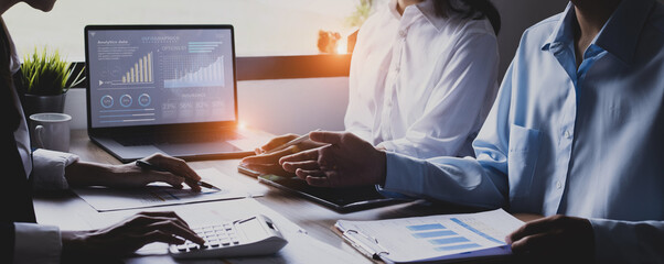 Technology and financial advisory services concert. Business teamwork and working on digital laptop computer with advisor showing plan of investment to clients at table office. Digital marketing.