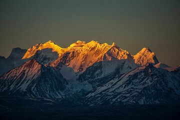 Canvas Print - Beautiful shot of the Pekucuo lake and Shishapangma snowy mountains during sunrise in Xigaze, China