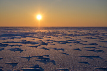 Wall Mural - the surface of a frozen lake. sunset in winter.