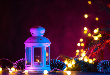 Canvas Print - Christmas lantern on a festive decorated table. Vintage garland and neon background lighting