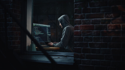 Aufkleber - Night Apartment: Evil Male Hacker wearing Hoodie Breaks into Data Server Room, DDOS Attack, Phishing Scheme, Malware. Darknet Cyber Crime Concept. View From Outdoors into Window.