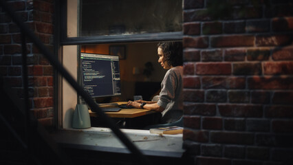 Aufkleber - Night Home Office: Young Hispanic Woman Working on Desktop Computer. Software Developer, e-Commerce Entrepreneur Writing Code for e-Business App, Designing Program. View From Outdoors into Window.
