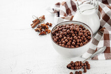 sweet crunchy chocolate children's breakfast chocolate balls on a white background