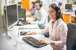 © Bojan - Professional helpline call center agent operator woman wearing headset working in customer care support service.