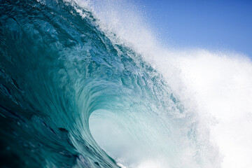 crest of a curling blue ocean wave