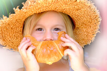 Close-up Of Child's Face, Girl 3 Years Old Holds Rosy Baked Croissant With Hands Near Mouth, Depicts Cheerful Smile, Concept Delicious Breakfast, Happy Childhood, Emotional Development Children