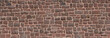 Alte Panorama Mauer aus rotem Sandstein - Nahaufnahme einer Kirchenmauer aus vielen viereckigen groben Natursteinen