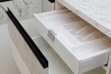 open white drawer for cutlery in the kitchen