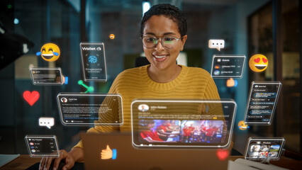 Beautiful Short Haired Project Manager Working on Computer in Office. Augmented Reality Social Media Icons Appear From Worker's Laptop. Internet of Things, Connectivity and Online Concept.