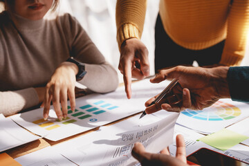 Ux ui designers come up with new ideas at a meeting to present in office mobile internet software layout design.