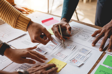 ux ui designers come up with new ideas at a meeting to present in office mobile internet software la