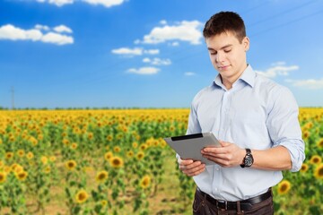 Canvas Print - Agronomist male farmer with digital tablet at field