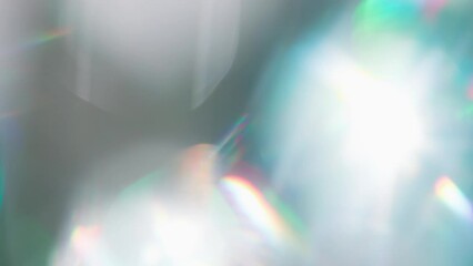Wall Mural - Rainbow Glare and Flicker. Loop. The light passes through the facets of a slowly rotating diamond and creates repetitive sparkling highlights and rainbow colors